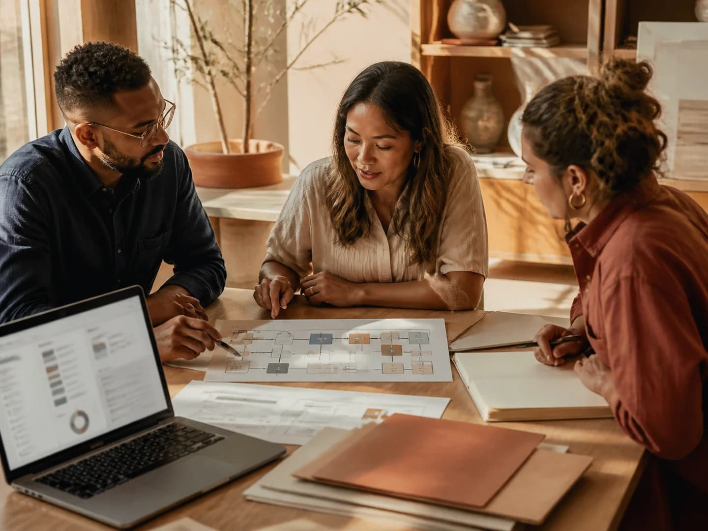 People reviewing documents, processes, and evidence for a proposal.